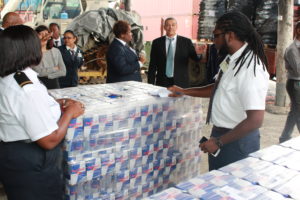 Commissioner General of the Guyana Revenue Authority (GRA) Godfrey Statia overlooking a cargo examination by Customs Officers at the Demerara Shipping Company Limited