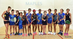 Guyana (black uniform) and Barbados pose for a photo before the Girls final