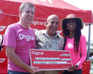 Dr Syed Ghazi (centre) of the Cancer Institute of Guyana is flanked by Digicel's CEO Kevin Kelly (left) and Head of Marketing, Jacqueline James