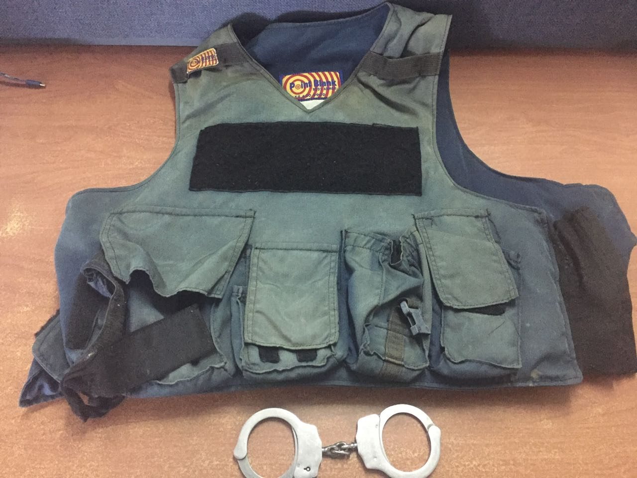 Licensed firearm holder busted with rifle, handcuff, bulletproof vest