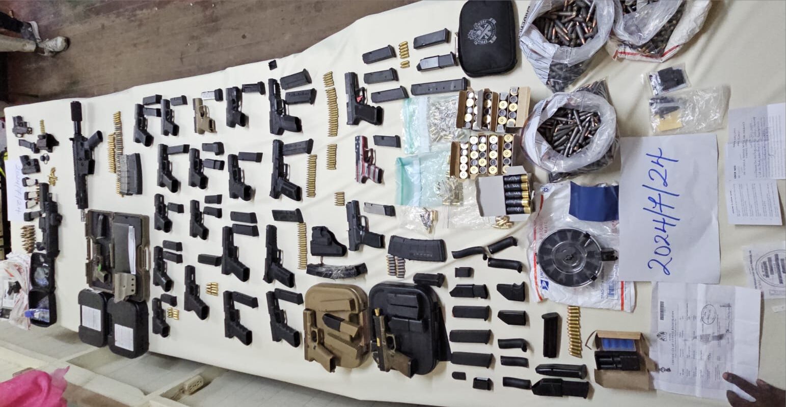 Five arrested after police operation uncovers large cache of firearms, ammo